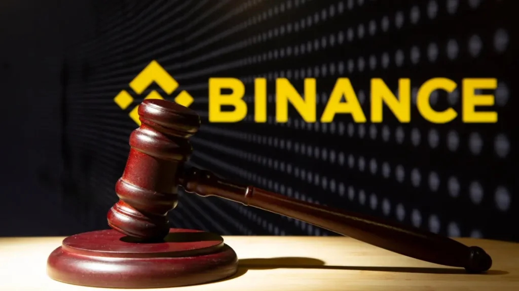 Binance and court session. Judicial hammer on the background of the logo