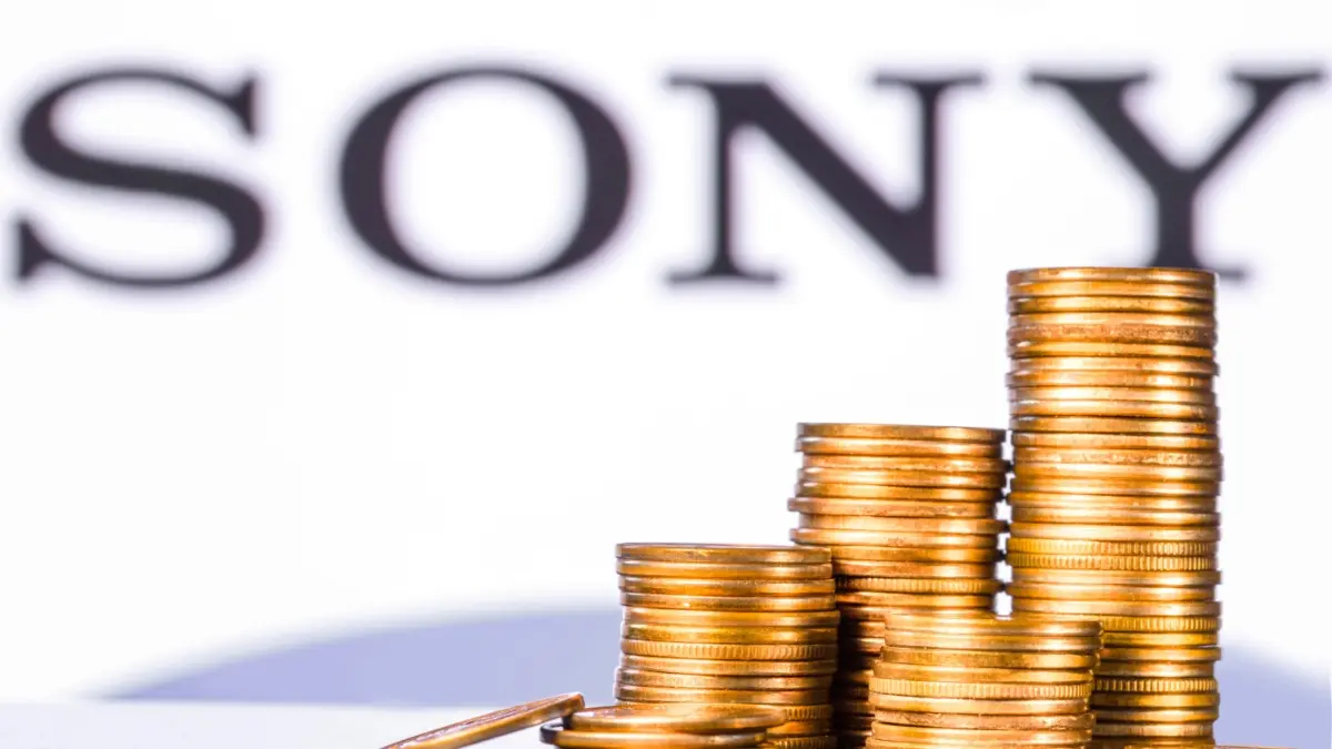 Business concepts with stacks of golden coins on the Sony logo background
