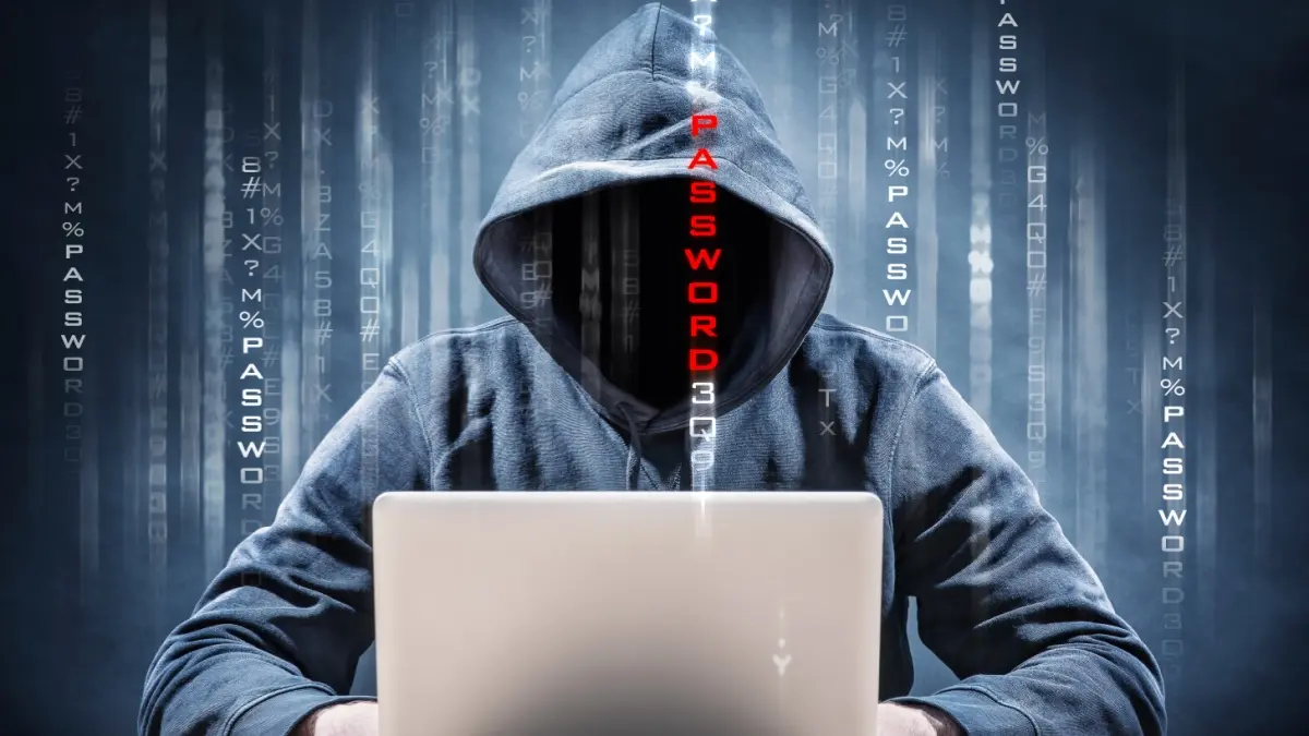 Hacker on a computer to symbolise identity fraud.