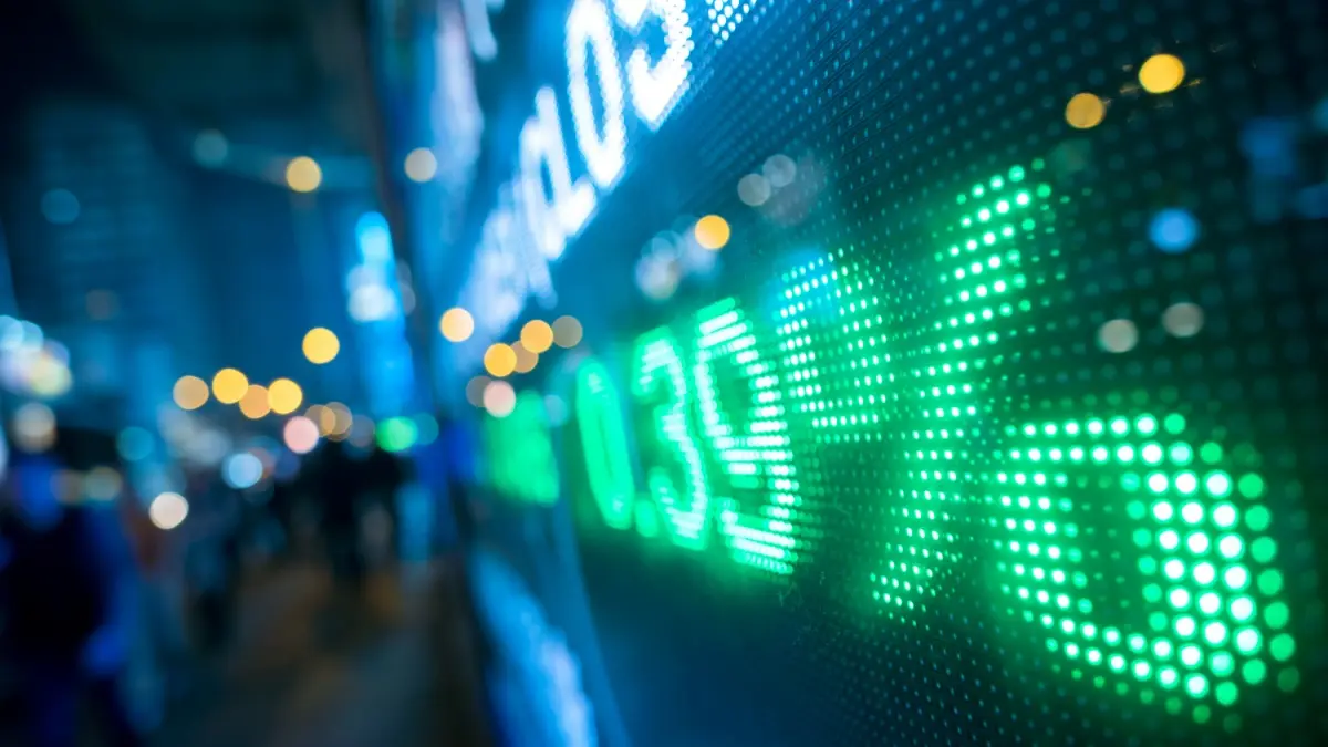 Display stock market numbers with defocused street lights background