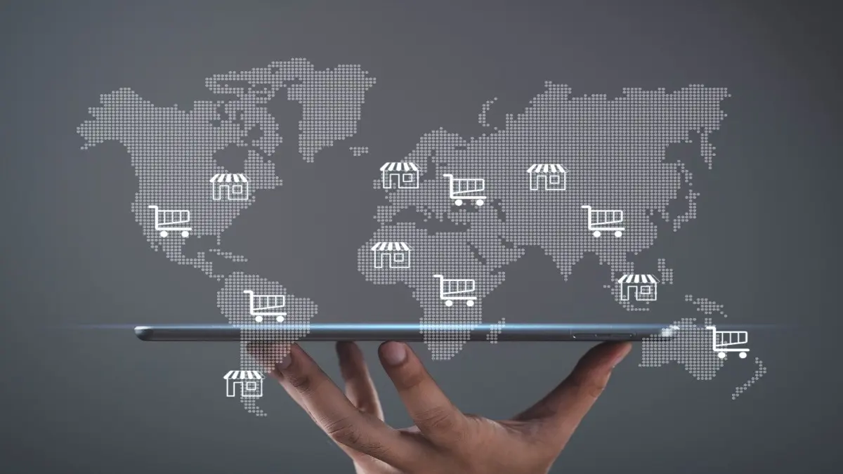 Global ecommerce with digital world map, online shopping carts and store on tablet, representing international business, global trade, online retail network, cross border commerce, digital marketplace