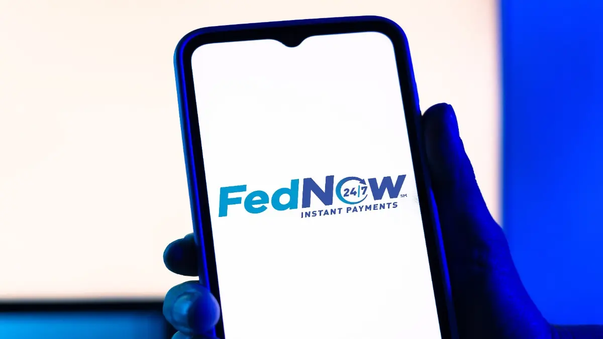 São Paulo, SP, Brasil - July 23, 2023: illustrative editorial. Hand holding a smartphone with the screen showing the FedNow logo, which is an instant payment service developed by the Federal Reserve